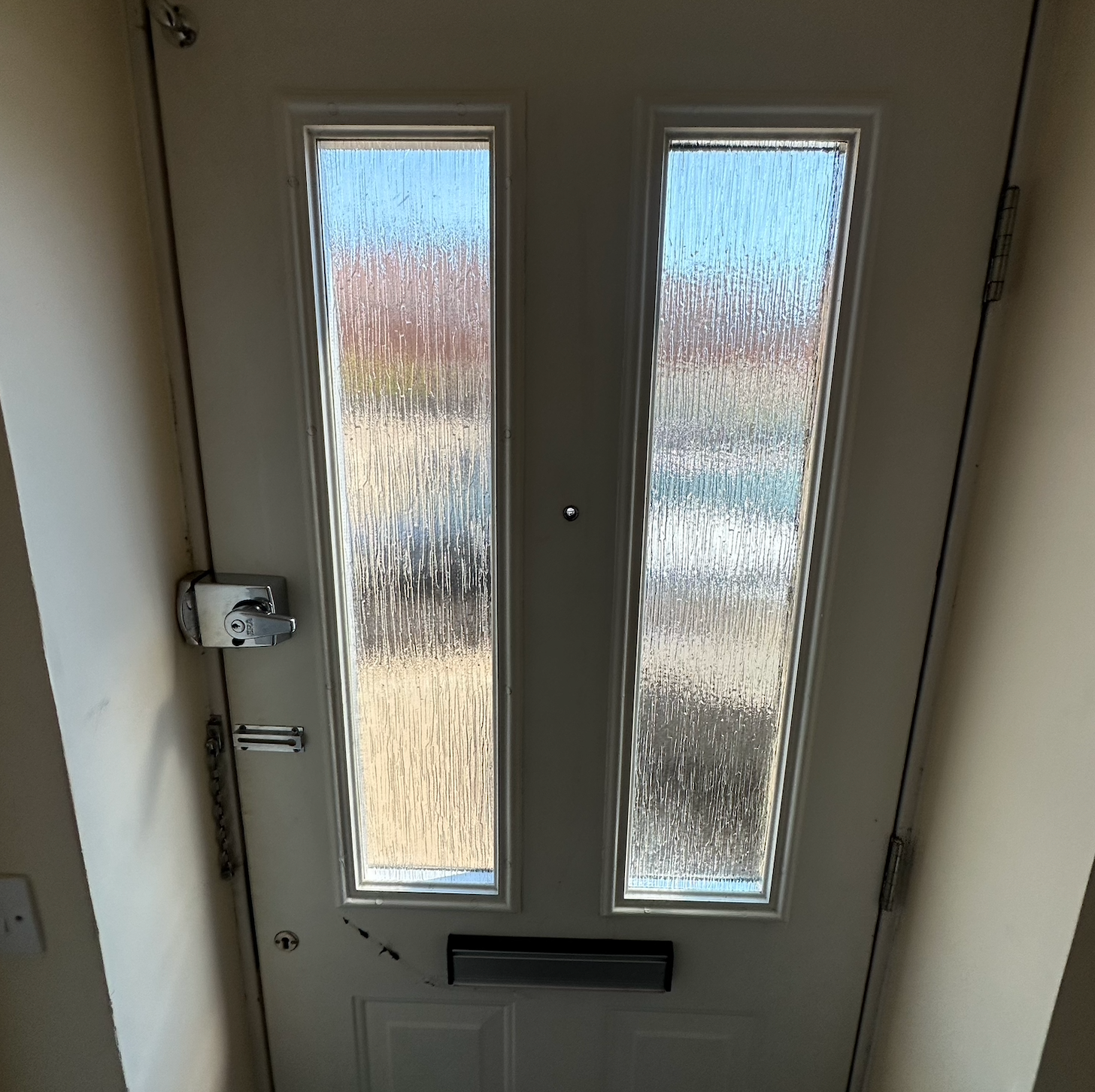 A composite door in which the double glazed glass section has been replaced. 