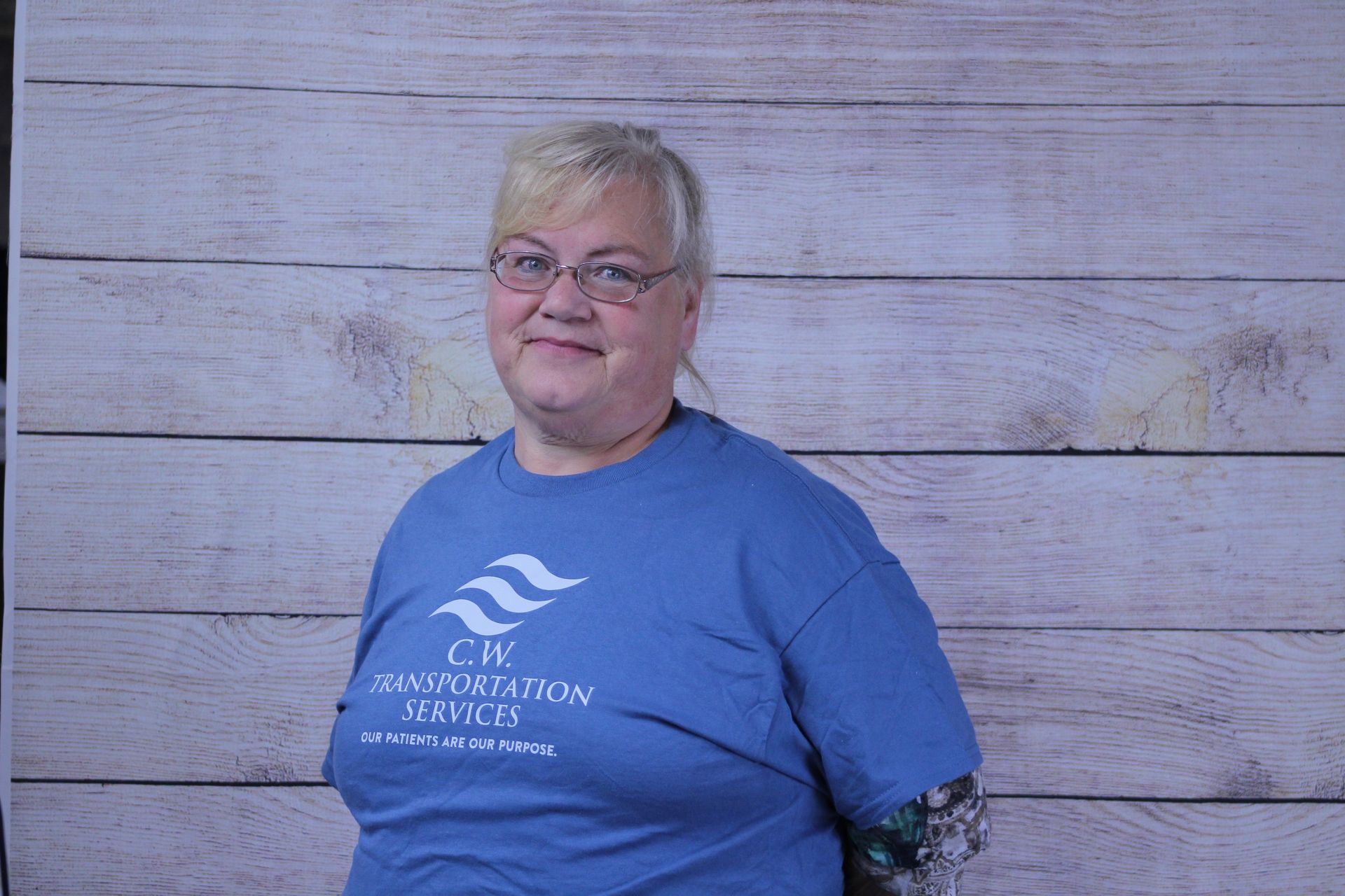 A person wearing a blue t-shirt with 