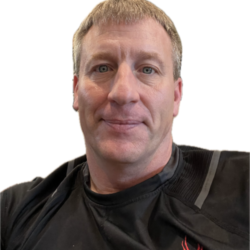 A man wearing a black shirt with a red flame on it