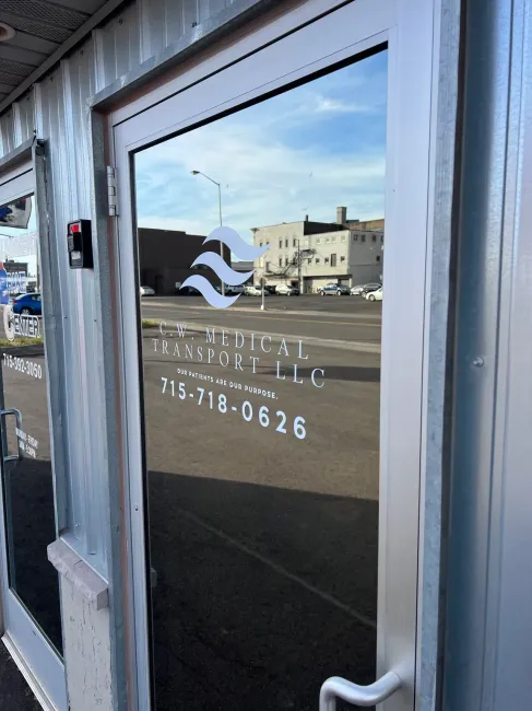 A reflection of a building in a glass door