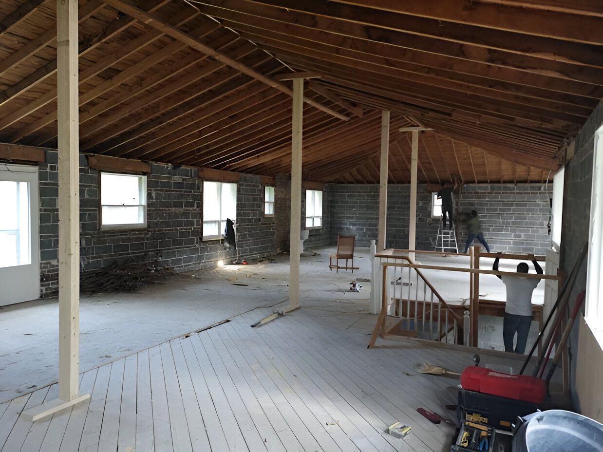 Interior of a home stripped to studs during residential demolition