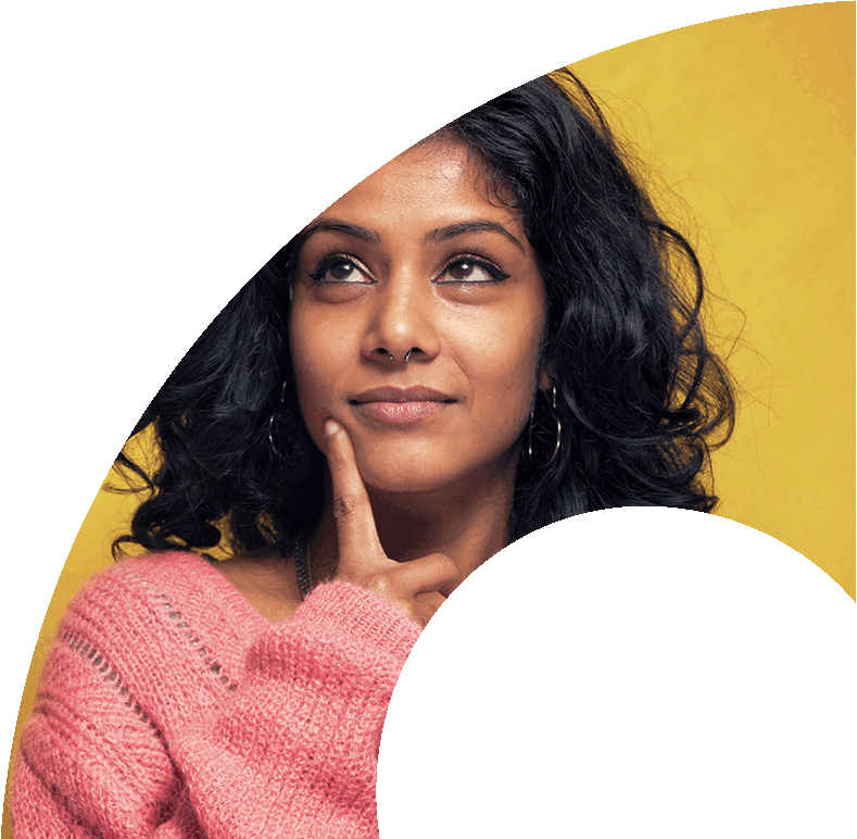 The woman is wearing a pink sweater and has a nose ring.