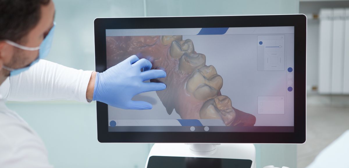 Doctor in gloves examines a 3D spine scan on a monitor