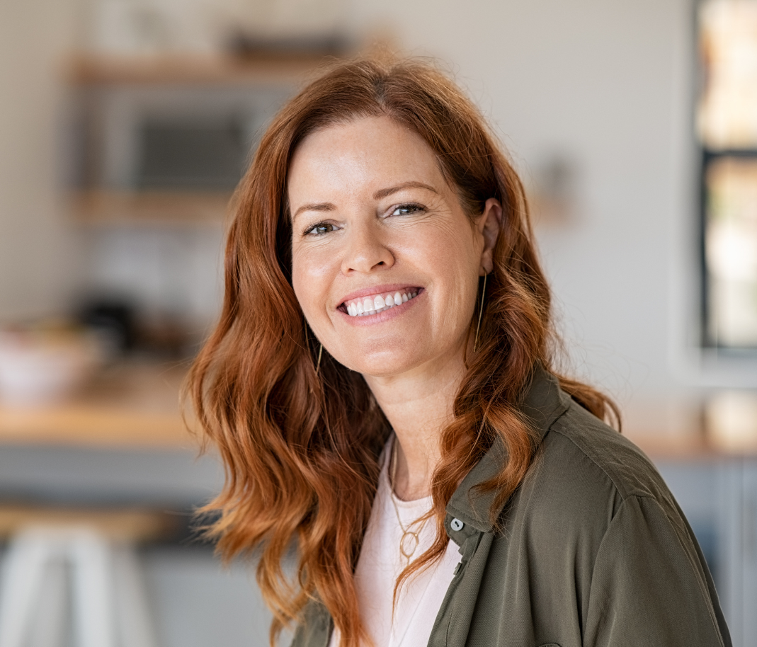 Woman with red hair smiling