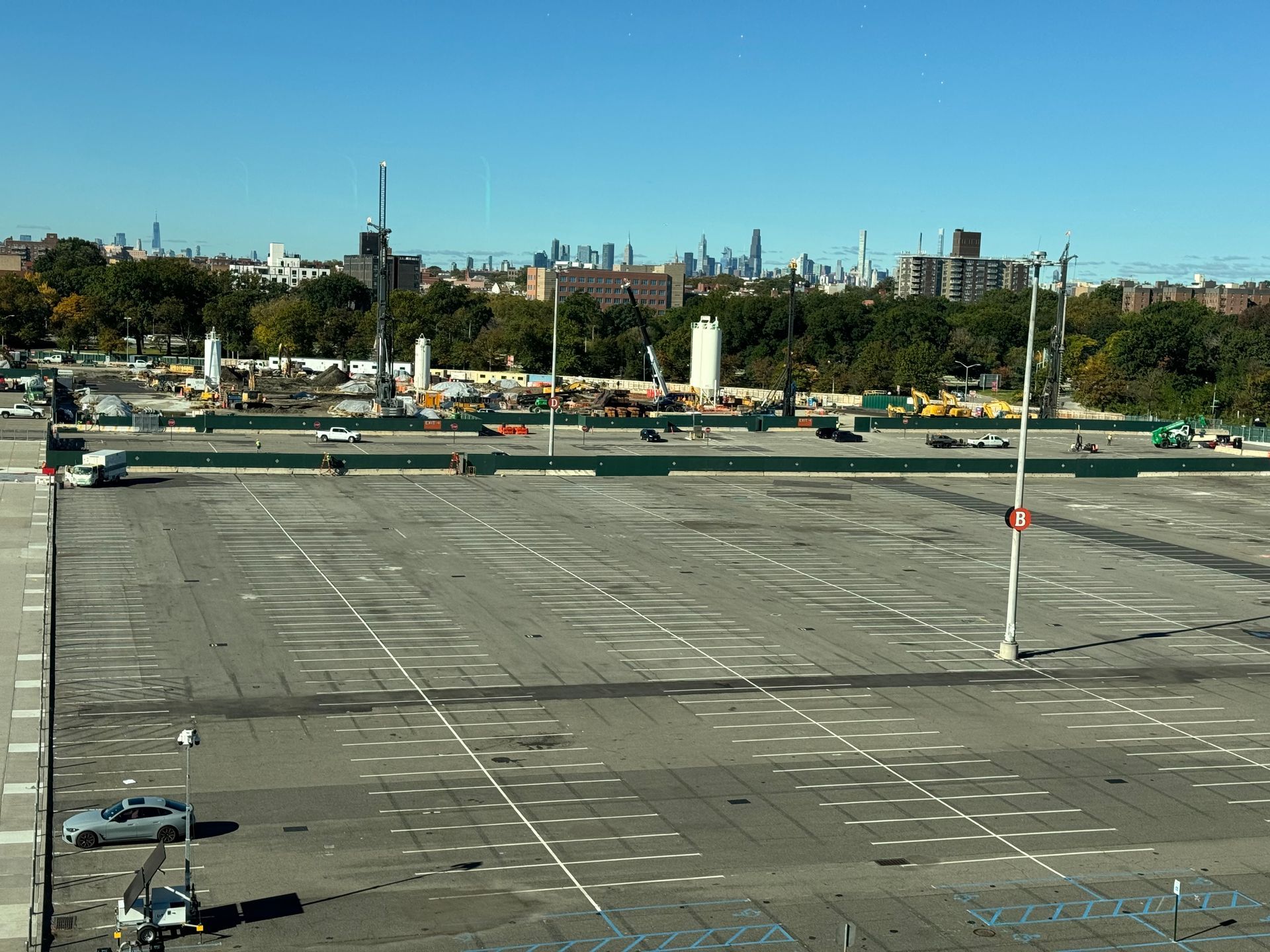 Empty parking lot with city skyline in the distance on a clear day