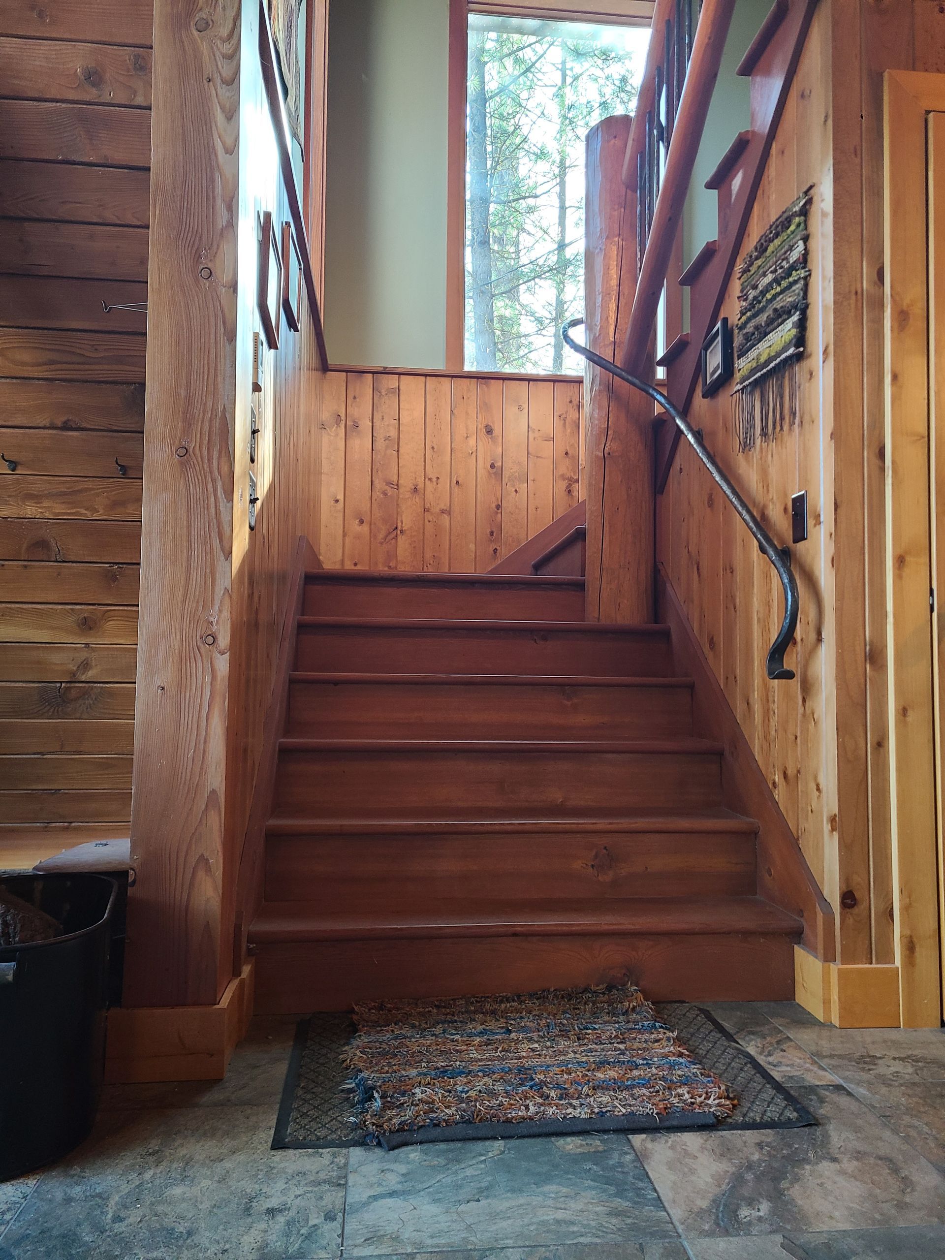Split view showing a construction site with debris on the left and a freshly painted room with wood flooring on the right.