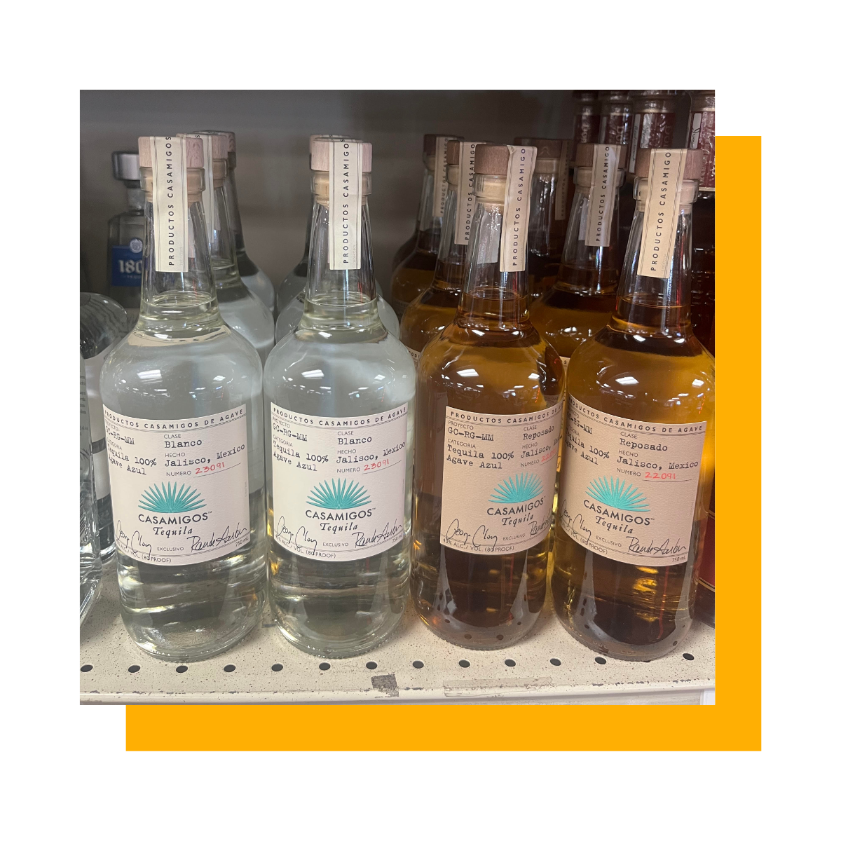 Bottles of tequila on a shelf. Some are clear and some are amber colored, all with labels.