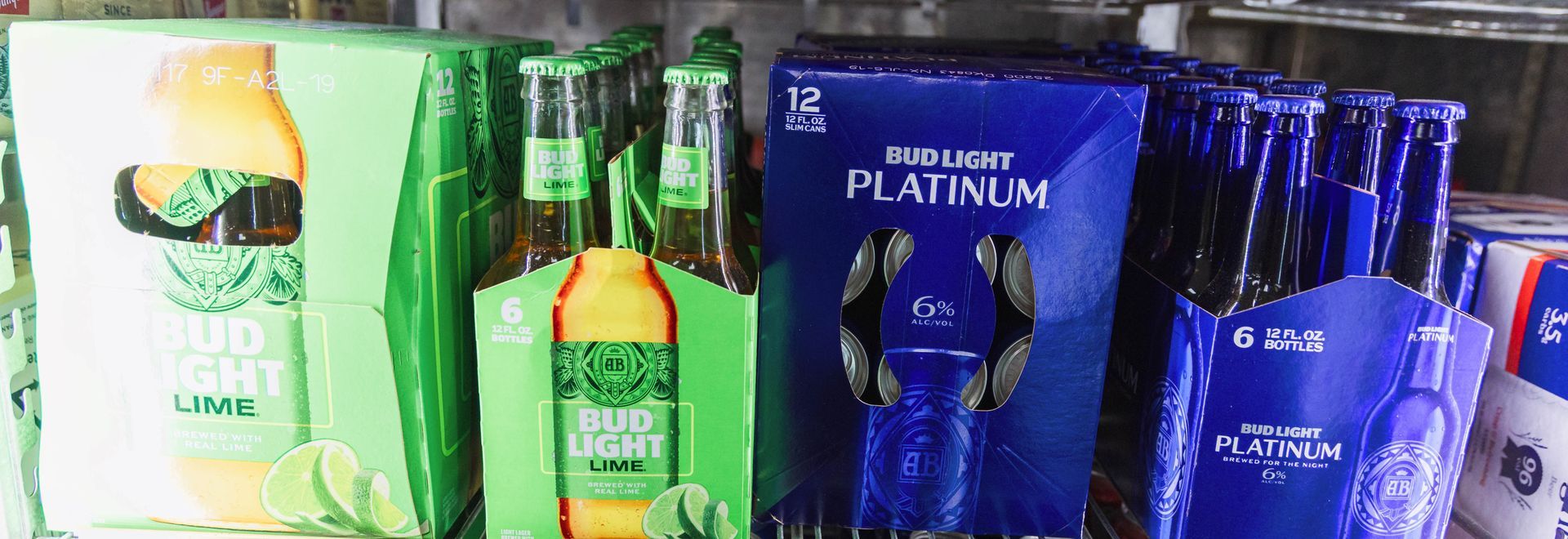 Shelves stocked with Bud Light and Bud Light Platinum beer in a store.
