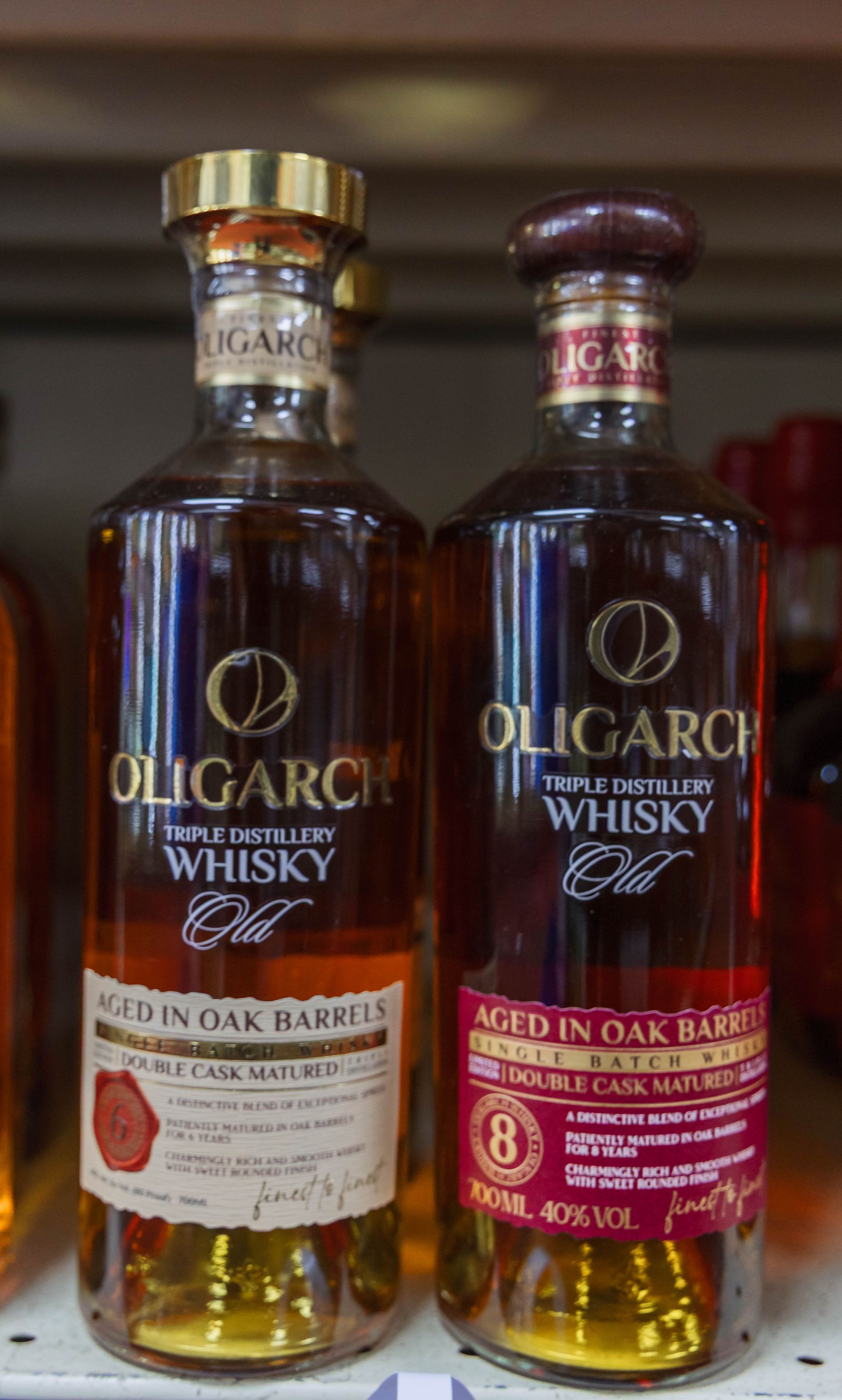 Two bottles of Oligarch triple batch low whisky aged in oak barrels.