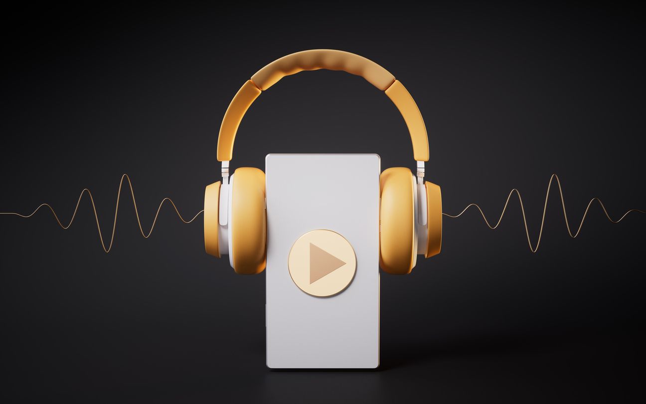 A pair of headphones sitting on top of a cell phone.