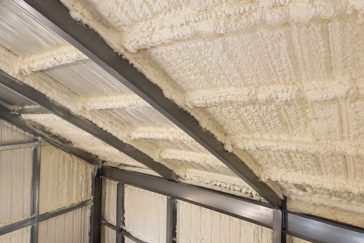 Spray foam insulation on metal building roof panels in Bedford, MA
