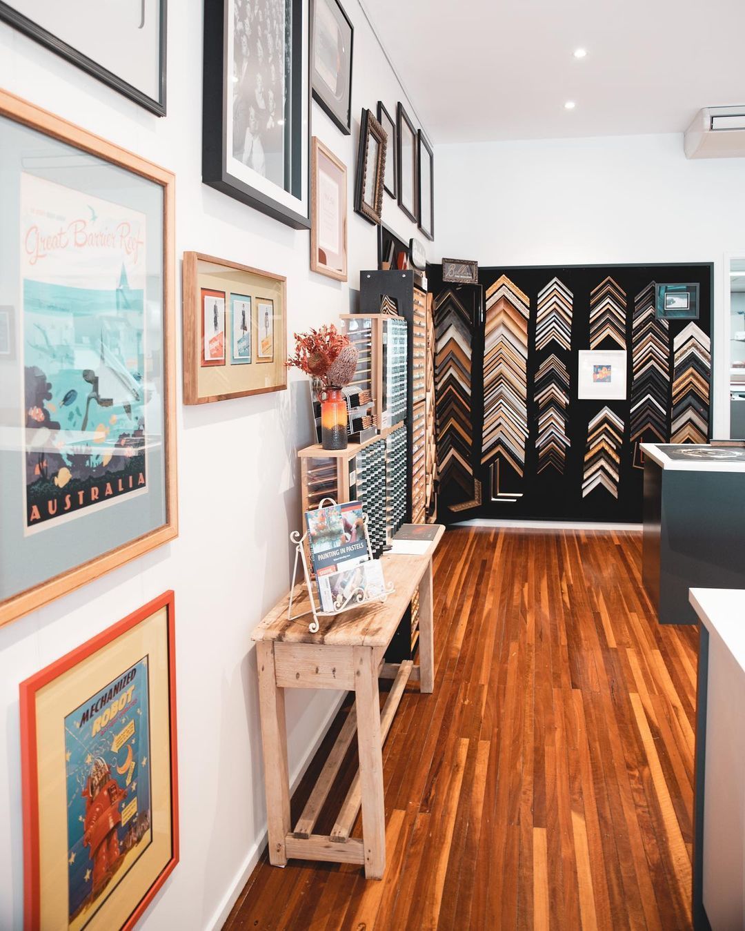 A Room with A Lot of Framed Pictures on The Wall — B Framed Picture Framing in Ballina, NSW