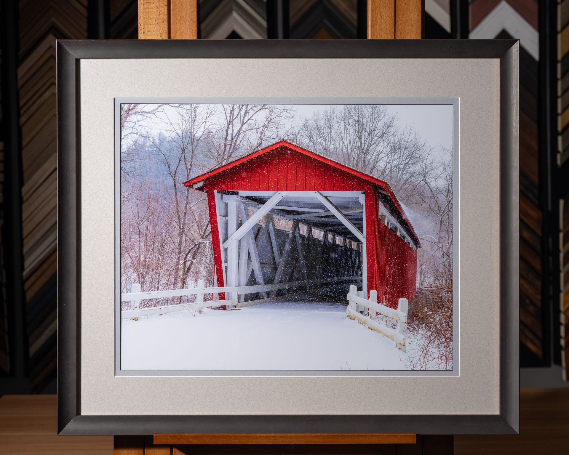 Custom framed print of a red covered bridge in snow