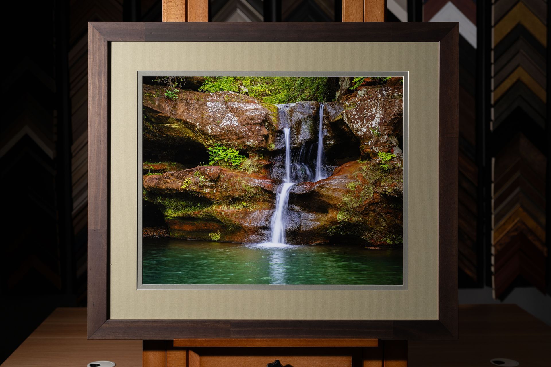 Custom framed waterfall photograph with neutral matting and dark wood frame