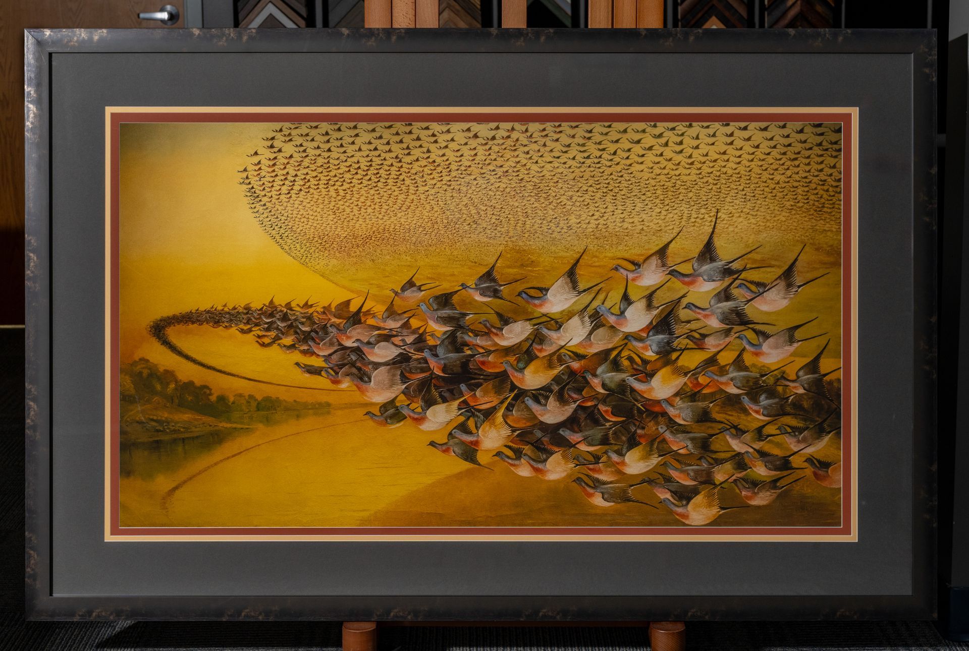 1. Custom framed artwork with decorative matting and dark frame