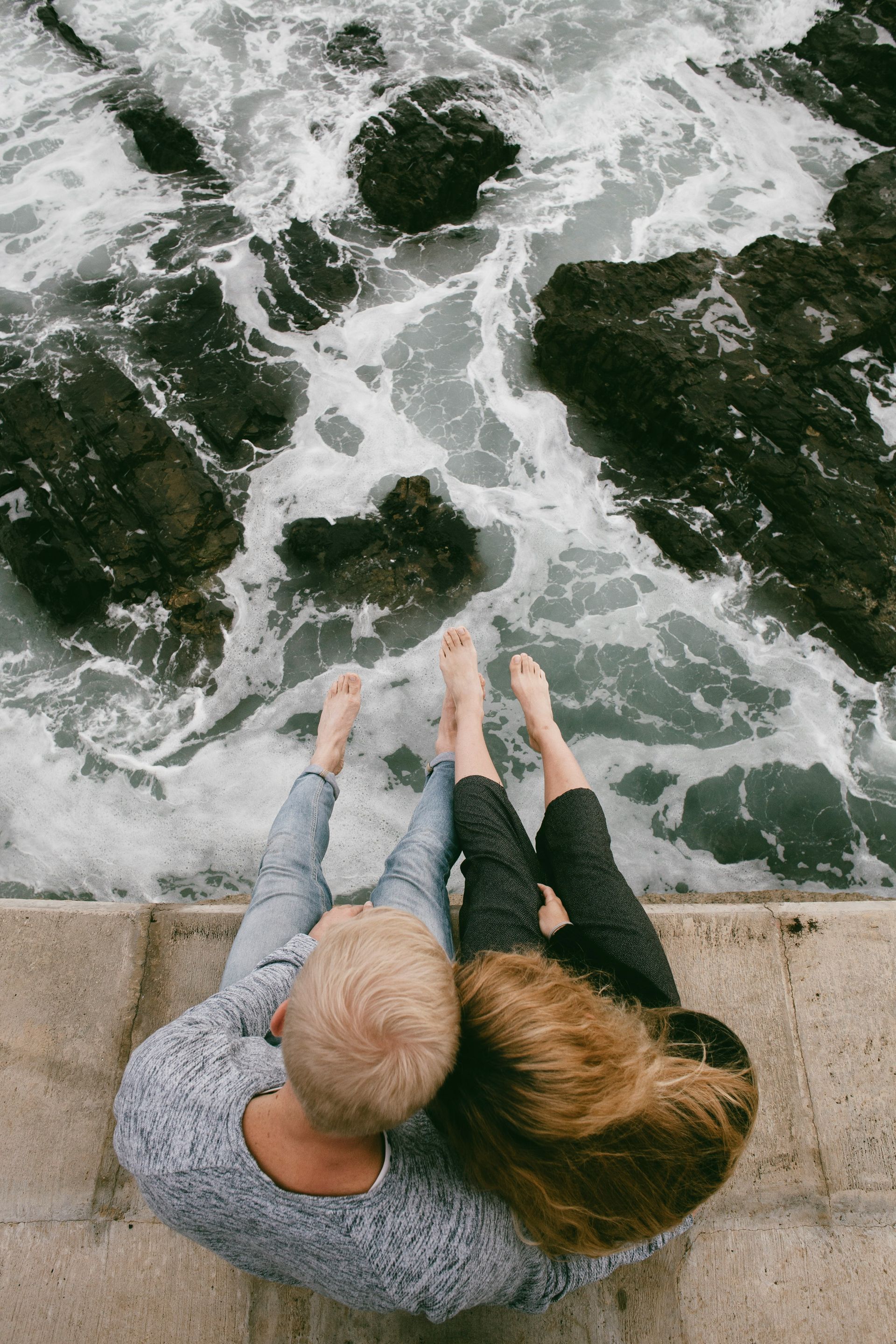 Couple by the ocean reviewing 2026 insurance options as recommended by Chehalem Insurance Associates.