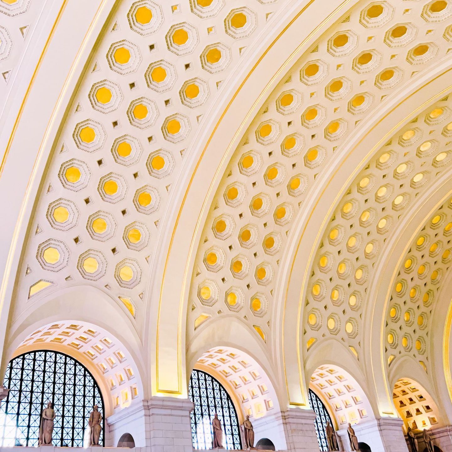 The ceiling of a building has a pattern of circles on it