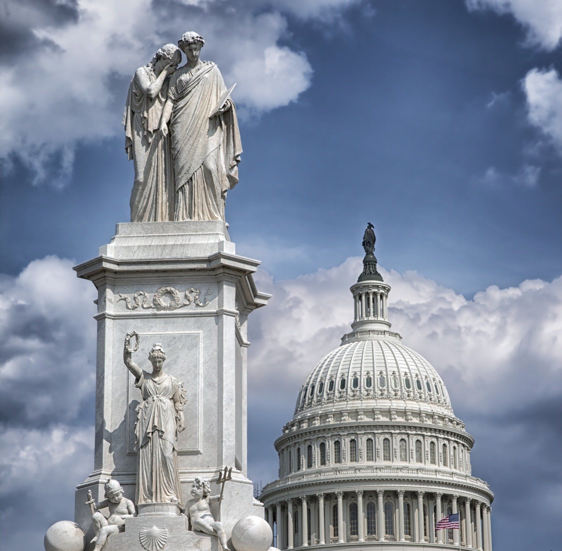 A statue in front of the capitol building