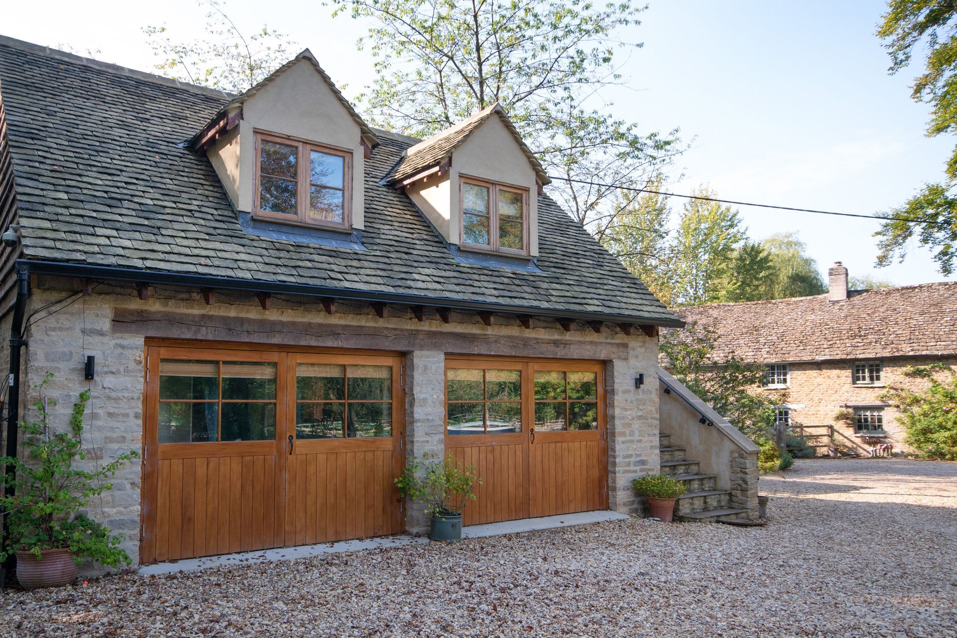 A renovated Georgian-styled heritage property with double garage outbuilding.