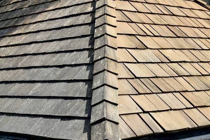 Wood shake roof with darker gray and lighter tan sections