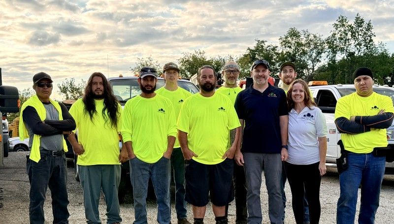 Haas Tree Service crew standing together in high-visibility work gear