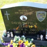A gravestone for a man named david arthur germy.