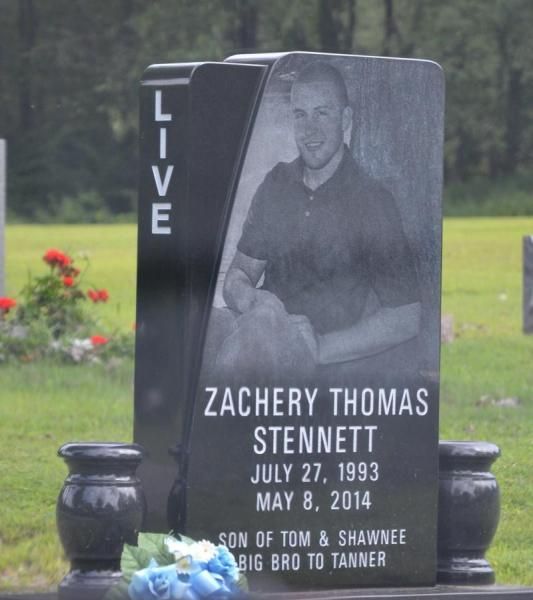 A gravestone for zachery thomas stennett in a cemetery
