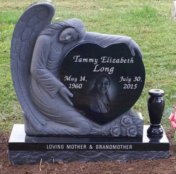 A tombstone for tammy elizabeth long with a heart shaped design