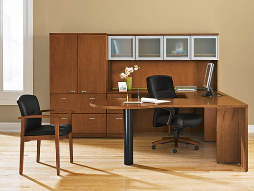 A wooden office with a desk and chairs