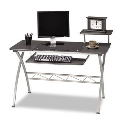 A desk with a computer monitor and keyboard on it