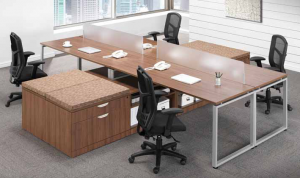 A conference room with a long wooden table and chairs.