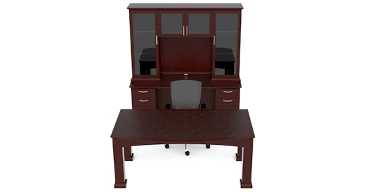 A wooden desk with a computer on top of it