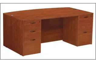 A wooden desk with drawers and a lock on it on a white background.
