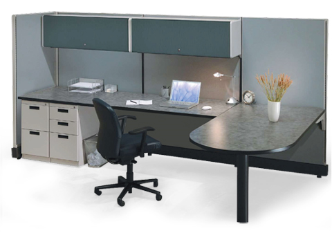A cubicle with a desk and chair with a laptop on it