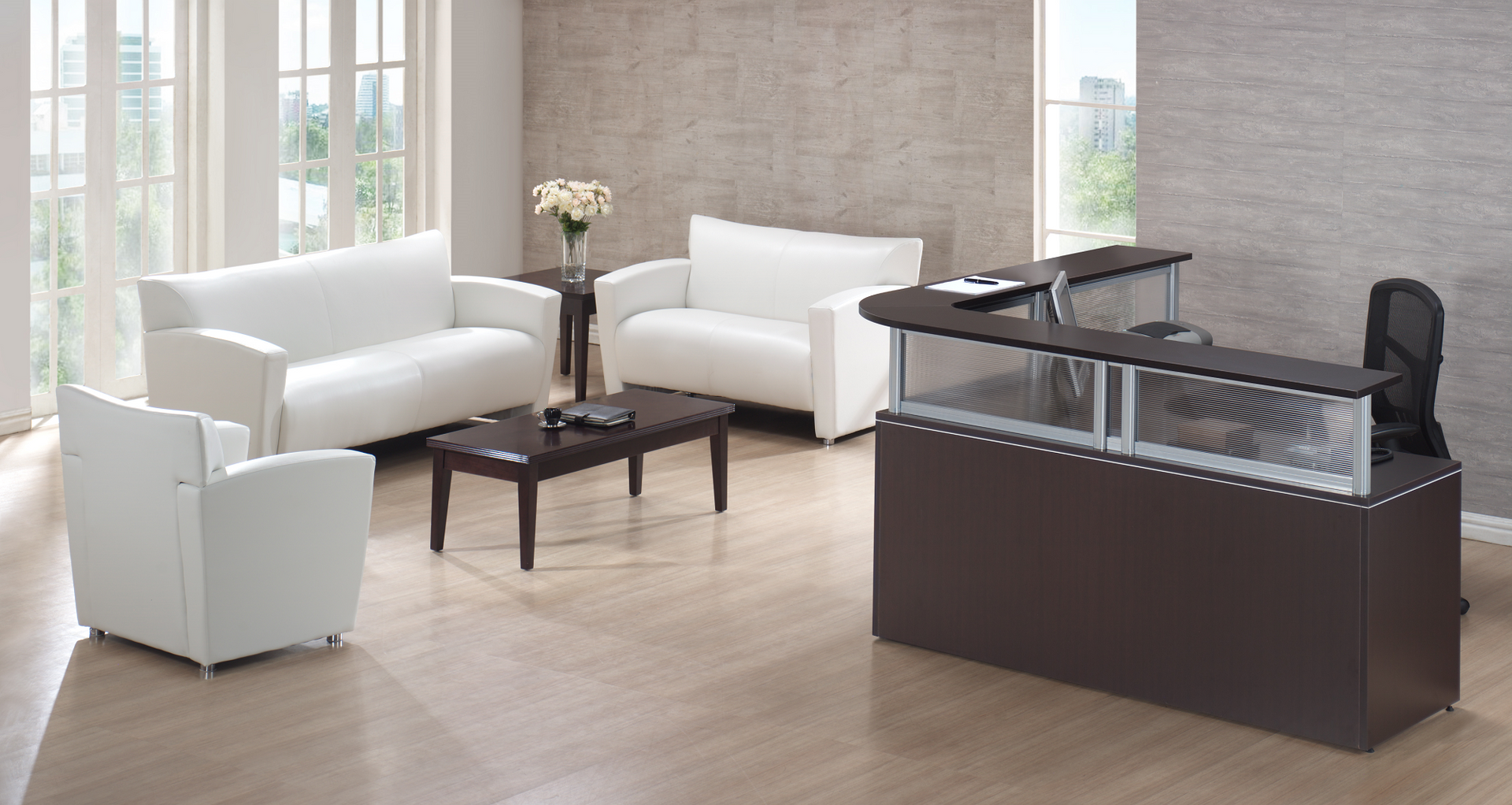 A living room with white furniture and a reception desk