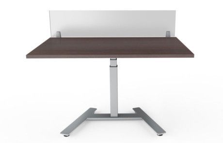 A standing desk with a wooden top and a white screen behind it.