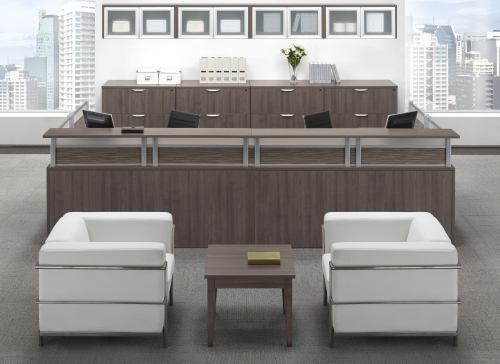 A reception area with two chairs and a table