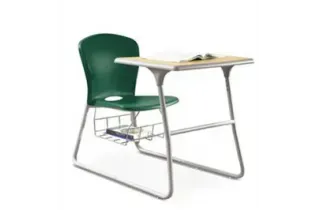 A green chair is sitting at a desk with a book on it.