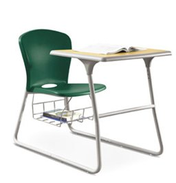 A green chair is sitting at a desk with a book on it.
