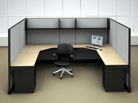 A cubicle with a chair and a laptop on the desk