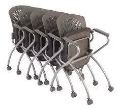 A row of folding chairs stacked on top of each other on a white background.