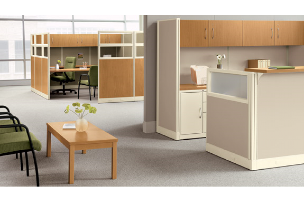 An office with cubicles and a coffee table