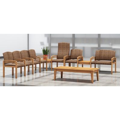 A row of chairs and a table in a waiting room.
