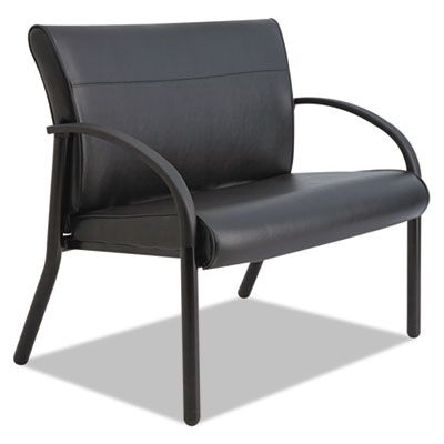 A black leather chair is sitting on a white surface.