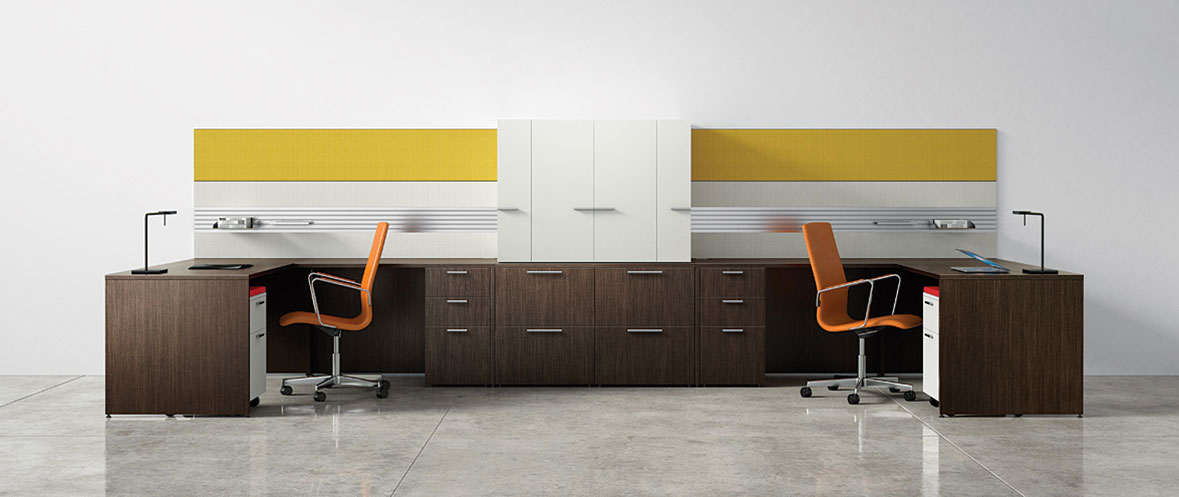 A room with two desks and two chairs in it.