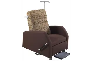 A brown hospital patient chair recliner with an iv pole attached to it.