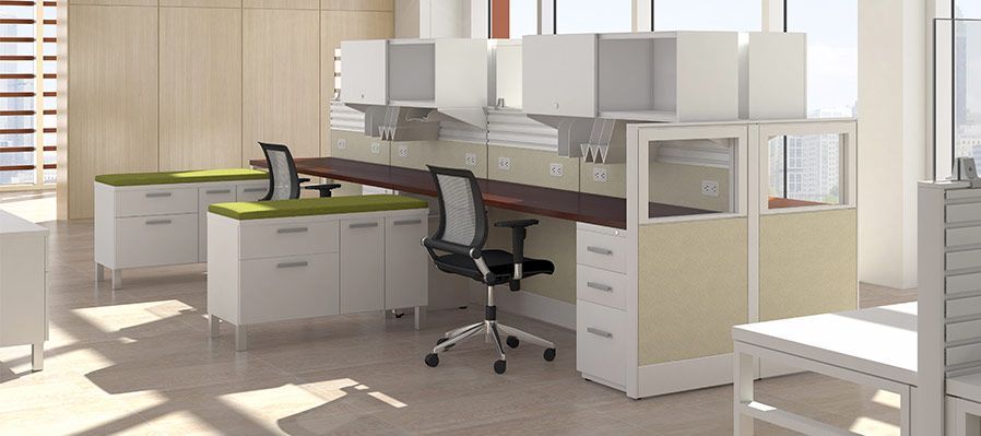 A large office with a lot of desks and chairs.