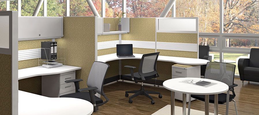 A computer generated image of an office with cubicles , desks , chairs and a table.