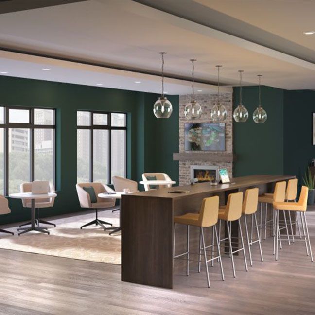 A large room with a long table and chairs