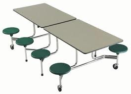 A table with green stools attached to it on a white background.